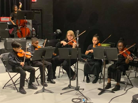  UBK String Ensemble playing violins